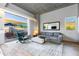 Living area features hardwood floors, large windows, and access to private patio at 5455 E Lincoln Dr # 1001, Paradise Valley, AZ 85253