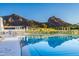 Resort-style pool with mountain backdrop and ample lounge space at 5455 E Lincoln Dr # 1001, Paradise Valley, AZ 85253