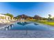 Inviting community pool with mountain views and lounge chairs at 5455 E Lincoln Dr # 1001, Paradise Valley, AZ 85253