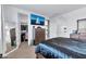 Well-lit bedroom with large closet and dresser at 5932 S 26Th Ave, Phoenix, AZ 85041