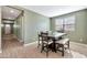 Small dining area with a square table and four chairs at 5932 S 26Th Ave, Phoenix, AZ 85041