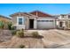 New construction home with a two-car garage and neutral exterior at 5932 S 26Th Ave, Phoenix, AZ 85041