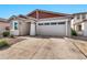 Modern home with a two-car garage and neutral exterior at 5932 S 26Th Ave, Phoenix, AZ 85041