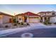 House exterior featuring a two-car garage and landscaping at 5932 S 26Th Ave, Phoenix, AZ 85041