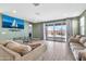 Bright living room with sliding doors leading to a patio and backyard at 5932 S 26Th Ave, Phoenix, AZ 85041