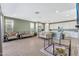 Spacious living area with an open floor plan and kitchen access at 5932 S 26Th Ave, Phoenix, AZ 85041