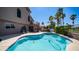 Resort-style backyard with a sparkling pool, patio, and lush landscaping, perfect for outdoor living at 6178 W Quail Ave, Glendale, AZ 85308