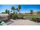 Balcony view overlooking green golf course with mature trees, palms and mountain views at 6178 W Quail Ave, Glendale, AZ 85308