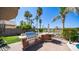 Outdoor kitchen featuring built-in grill, bar, and patio area ideal for entertaining at 6178 W Quail Ave, Glendale, AZ 85308