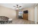 Neutral bedroom with ceiling fan, window with natural light, chair, desk, and dresser at 6178 W Quail Ave, Glendale, AZ 85308