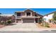 Charming two-story home featuring a three car garage and well-manicured landscaping at 6178 W Quail Ave, Glendale, AZ 85308