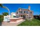 Stunning home featuring a backyard with pool, BBQ, grass and an exterior wrought iron staircase at 6178 W Quail Ave, Glendale, AZ 85308