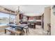 Open kitchen featuring dark wood cabinetry, granite countertops, and a breakfast bar area with views of the backyard at 6178 W Quail Ave, Glendale, AZ 85308