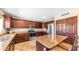 Gourmet kitchen with granite countertops, stainless steel appliances, and custom cabinetry at 6178 W Quail Ave, Glendale, AZ 85308