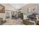 Spacious living area with high ceilings, a chandelier, and ample natural light, perfect for entertaining or relaxation at 6178 W Quail Ave, Glendale, AZ 85308
