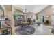 Bright living area with a bay window, chandelier, and comfortable seating, creating a cozy and inviting atmosphere at 6178 W Quail Ave, Glendale, AZ 85308