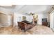 Bright living room with plush seating, decorative fireplace, and sliding doors leading to the backyard patio at 6178 W Quail Ave, Glendale, AZ 85308