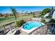 Backyard view of the pool and golf course from above the exterior staircase at 6178 W Quail Ave, Glendale, AZ 85308