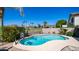 Sparkling pool with basketball hoop and lush landscaping in a private backyard oasis at 6178 W Quail Ave, Glendale, AZ 85308