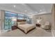 Main bedroom with large windows, plush carpet, and modern furnishings at 7117 E Rancho Vista Dr # 3006, Scottsdale, AZ 85251
