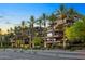 Luxury building exterior with palm trees and street view at 7117 E Rancho Vista Dr # 3006, Scottsdale, AZ 85251