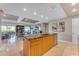 Open kitchen with island, granite counters, and stainless steel appliances at 7117 E Rancho Vista Dr # 3006, Scottsdale, AZ 85251