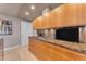 Modern kitchen with granite counters, wood cabinets, and gas cooktop at 7117 E Rancho Vista Dr # 3006, Scottsdale, AZ 85251