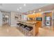 Modern kitchen with island, granite countertops, and wood cabinetry at 7117 E Rancho Vista Dr # 3006, Scottsdale, AZ 85251