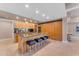 Modern kitchen with wood cabinetry, granite countertops, and island at 7117 E Rancho Vista Dr # 3006, Scottsdale, AZ 85251