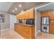 Updated kitchen with wood cabinets, granite counters, and laundry area at 7117 E Rancho Vista Dr # 3006, Scottsdale, AZ 85251