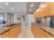 Gourmet kitchen features granite countertops and wood cabinetry at 7117 E Rancho Vista Dr # 3006, Scottsdale, AZ 85251