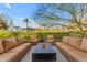 Spacious patio with fire pit and surrounding landscaping at 7117 E Rancho Vista Dr # 3006, Scottsdale, AZ 85251