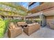 Relaxing patio with wicker furniture and fire pit at 7117 E Rancho Vista Dr # 3006, Scottsdale, AZ 85251