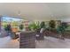 Covered patio with wicker furniture and lush landscaping at 7117 E Rancho Vista Dr # 3006, Scottsdale, AZ 85251
