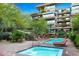 Relaxing pool and spa area with lounge chairs and outdoor seating at 7117 E Rancho Vista Dr # 3006, Scottsdale, AZ 85251