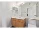 Bathroom features a vanity with wood cabinets and a toilet at 7887 N 16Th St # 217, Phoenix, AZ 85020