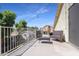 Relaxing balcony with patio furniture and backyard view at 9011 W Harmony Ln, Peoria, AZ 85382