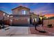 Two-story house with attached garage and desert landscaping at 9011 W Harmony Ln, Peoria, AZ 85382