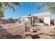 Backyard view showing a patio and gravel landscaping at 9041 W Virginia Ave, Phoenix, AZ 85037