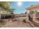 Backyard with gravel, a grill, and a patio at 9041 W Virginia Ave, Phoenix, AZ 85037