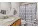 Bathroom features granite countertop, sink, and shower/tub combo at 9041 W Virginia Ave, Phoenix, AZ 85037