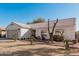 Single-story home with a two-car garage and front yard at 9041 W Virginia Ave, Phoenix, AZ 85037