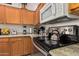 Modern kitchen features granite countertops and stainless steel appliances at 9041 W Virginia Ave, Phoenix, AZ 85037