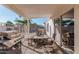 Covered patio with grill, table, and chairs at 9041 W Virginia Ave, Phoenix, AZ 85037