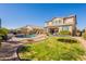Landscaped backyard oasis with pool, trampoline, and patio at 9127 E Lynwood St, Mesa, AZ 85207