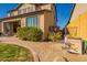 Landscaped backyard with a large dog house and patio at 9127 E Lynwood St, Mesa, AZ 85207