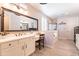 Elegant bathroom with double vanity and soaking tub at 9127 E Lynwood St, Mesa, AZ 85207
