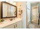 Bathroom with vanity, bathtub, and updated fixtures at 9127 E Lynwood St, Mesa, AZ 85207