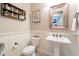 Powder room with pedestal sink and wooden accents at 9127 E Lynwood St, Mesa, AZ 85207