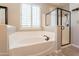 Clean bathroom with a shower and a soaking tub at 9127 E Lynwood St, Mesa, AZ 85207